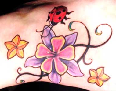 ladybug with flower tattoo